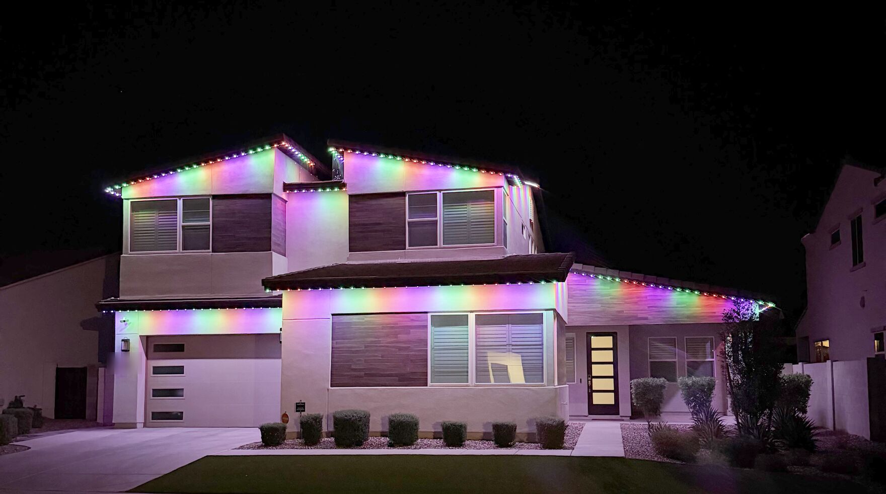 Example home with permanent roofline lighting at night